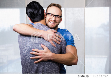Smiling gay couple embracing 20683292