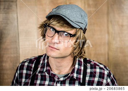 Serious blond hipster staring 20683865