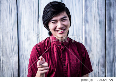 Smiling hipster pointing the camera Smiling hipster pointing the camera 20684159