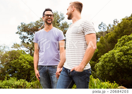 Smiling gay couple looking at each other 20684203