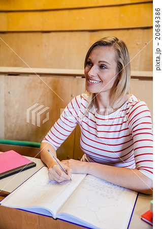 Happy female student looking away 20684386
