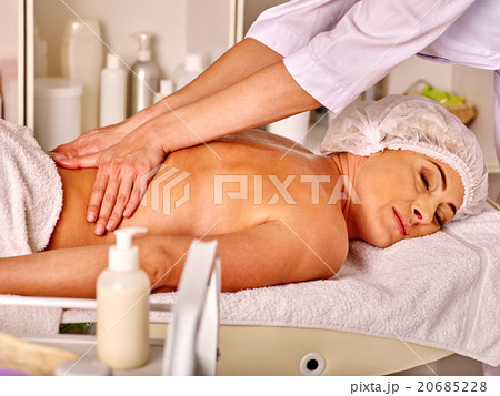 Woman middle-aged in spa salon with beautician. 20685228