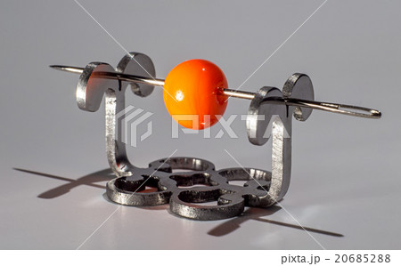 Orange glassy bead on the needle 20685288