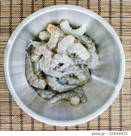 raw prawns in a white bowl without a marinate 20688825