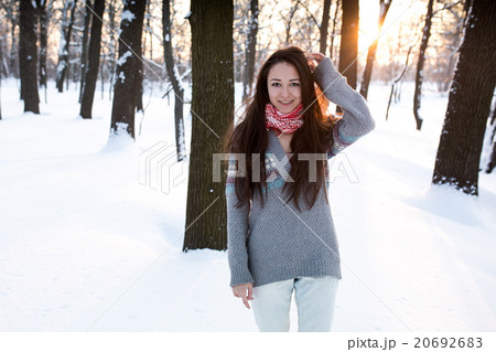 attractive young woman (Girl) playing with snow attractive young woman (Girl) playing with snow 20692683