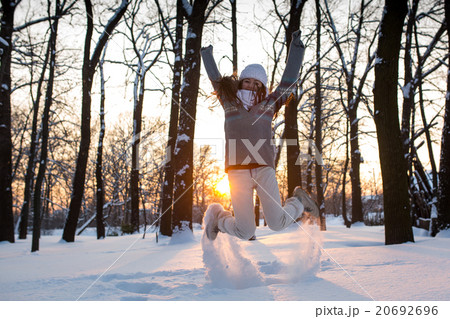 attractive young woman (Girl) playing with snow attractive young woman (Girl) playing with snow 20692696