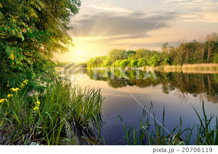 Vibrant sunset on river Vibrant sunset on river 20706119