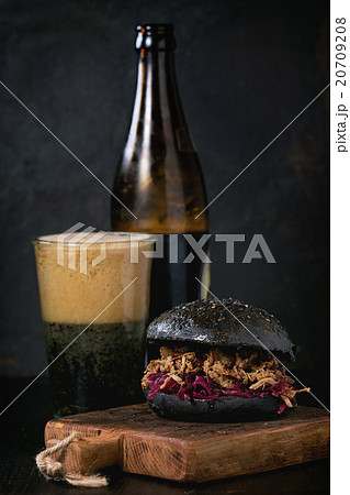 Black burger with dark beer 20709208