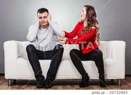 Wife shouting at husband. Cheating man. Betrayal. 20710985