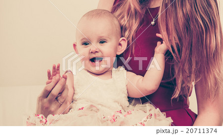 Happy baby girl on mother knees. Happy baby girl on mother knees. 20711374