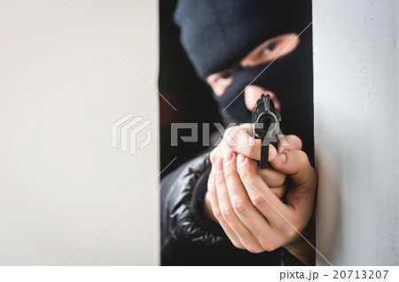 Aiming murderer with a gun Aiming murderer with a gun 20713207