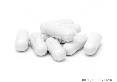 White medicine capsules isolated on white 20716481