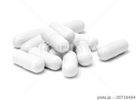 White medicine capsules isolated on white 20716484