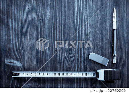 tape measure and pencil on wood 20720206