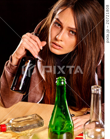 Drunk girl holding bottle of vodka. Drunk girl holding bottle of vodka. 20721808