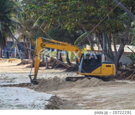 backhoe working on beach 20722291