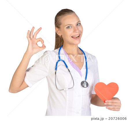 Woman intern holding paper heart in her hand and 20726006