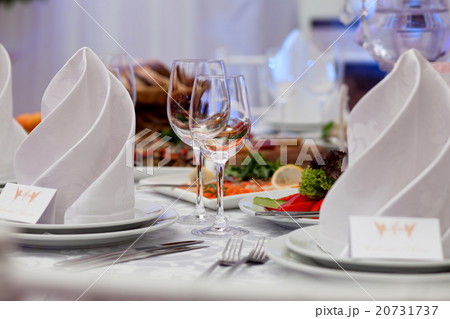 Wine glasses, napkins and salad for the banquet. Wine glasses, napkins and salad for the banquet. 20731737