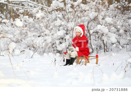 Young lady in winter forest 20731886