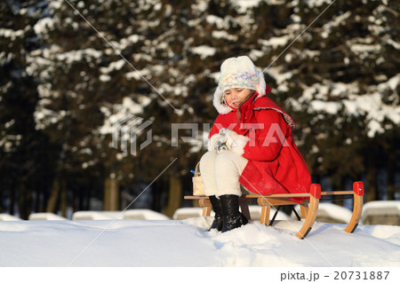 Young lady in winter forest 20731887