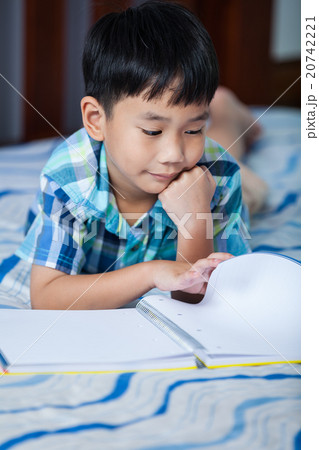 Asian boy reading a book. Education concept. Asian boy reading a book. Education concept. 20742221