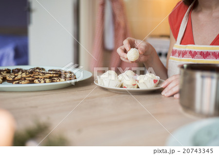 Woman is making christmas cakes Woman is making christmas cakes 20743345