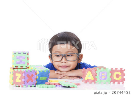 Cute boy playing with letters Cute boy playing with letters 20744452