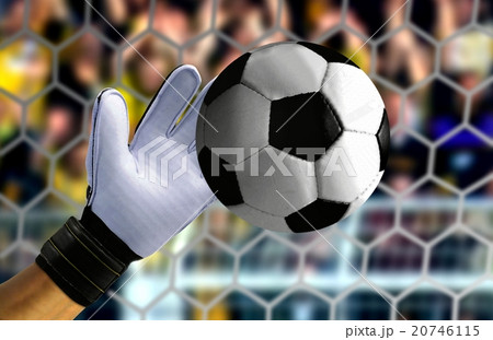 Goal keeper hand stopping a fast ball 20746115
