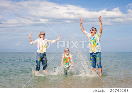 Happy family playing on the beach at the day time. Happy family playing on the beach at the day time. 20749193