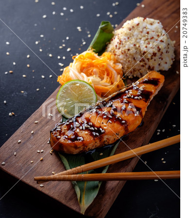 Teriyaki salmon with rice on a wooden platter 20749383