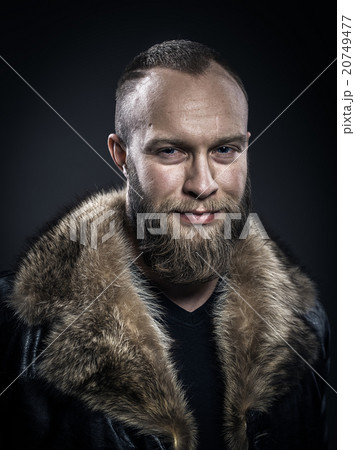 Brutal handsome smiling unshaven man 20749477