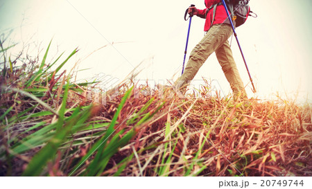 young woman hiker hiking on seaside trail 20749744