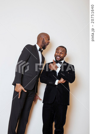 two afro-american businessmen in black suits two afro-american businessmen in black suits 20751640