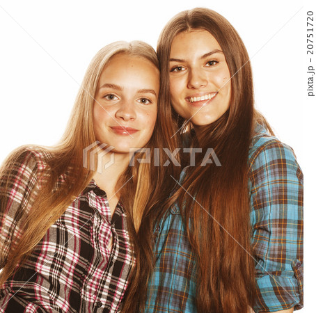 two cute teenagers having fun together isolated on 20751720