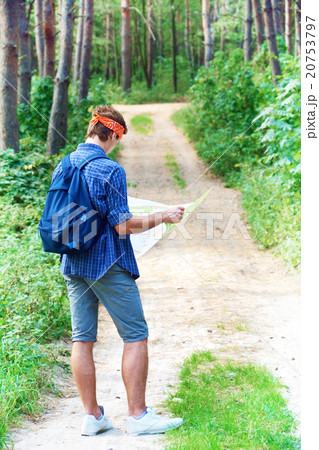 Young man is exploring the map Young man is exploring the map 20753797