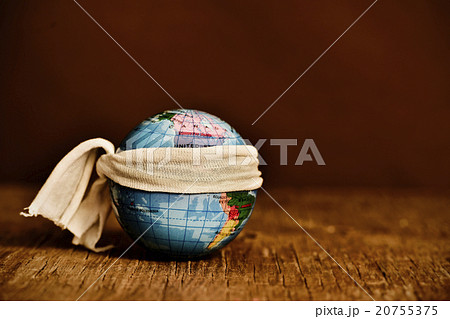 piece of cloth tied around a terrestrial globe 20755375