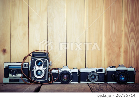 Retro cameras on wood background Retro cameras on wood background 20755714