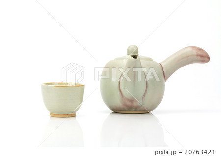 Ceramic teapot and tea cup isolated on white 20763421