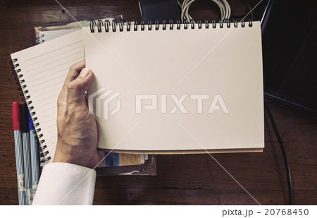 hand holding notebook hand holding notebook 20768450