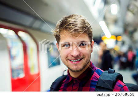 Close up, hipster man on platform against subway 20769659