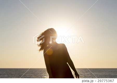 sunset and silhouette of a teenage girl in motion sunset and silhouette of a teenage girl in motion 20775367
