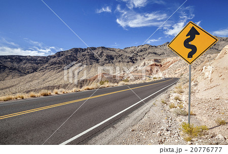 Picture of a winding road ahead sign 20776777