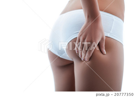 Cheerful young woman with perfect fit figure 20777350