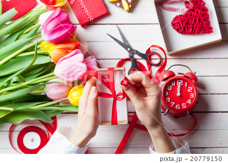 Female hands are holding a gift 20779150