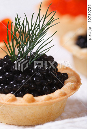 Canapes with black sturgeon fish macro 20780726
