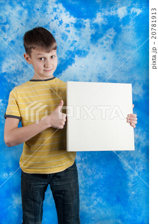 Cute boy posing with a white board 20781913