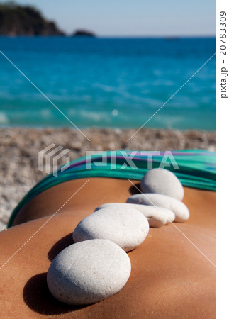 Beautiful woman getting hot stones treatment 20783309