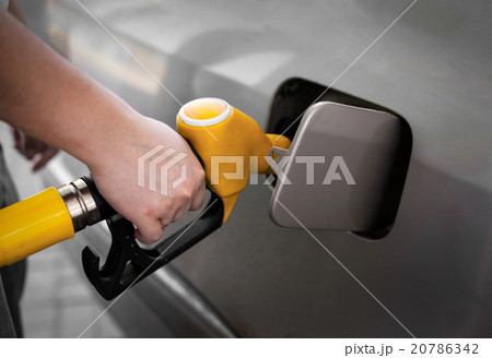 Driver pumping gasoline at the gas station Driver pumping gasoline at the gas station 20786342