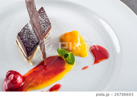 sweet white-brown chocolate dessert with fruits 20786603