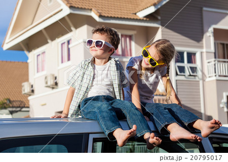 Happy children getting ready for road trip on a sunny day. Happy children getting ready for road trip on a sunny day. 20795017